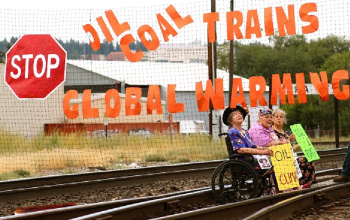 Spokane residents occupy railroad tracks in protest of fossil fuel trains